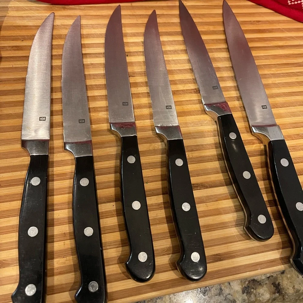 Set of Six Black Handle Wolfgang Puck Steak Knives